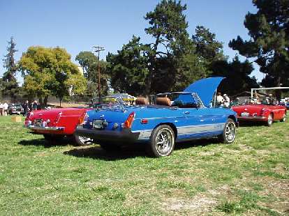 MGBs. The blue one is a later rubber-bumper type. MGBs. The blue one is a later rubber-bumper type.