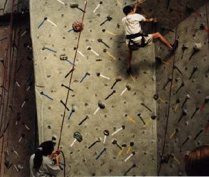 That's Loren C. doing an impressive move on the overhang, with Adrienne belaying.