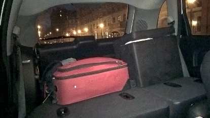 suitcase, ottomans, seats folded down, inside PT Cruiser