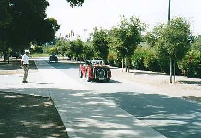A pre-war MG Midget driving through Stanford.