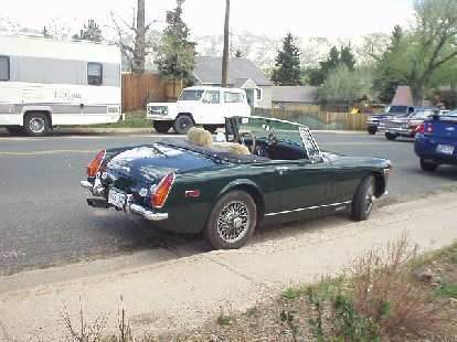 A diminutive MG Midget, probably a '71 (note the round rear fenders). A diminutive MG Midget, probably a '71 (note the round rear fenders).