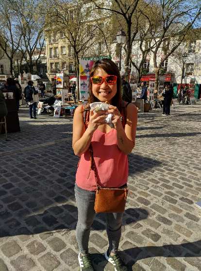 Photo: Angie with a crepe in front of Place de Tertre in Montmartre.