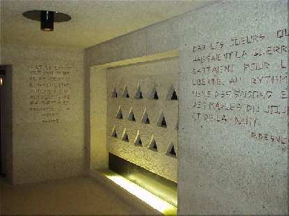 The triangles are representative of the identification patches inmates were forced to wear. Just to the right of this, above the exit, are the words, "Pardonne, n'oublie pas..." ("Forgive, don't forget...") (17 Aug 2003) The triangles are representative of the identification patches inmates were forced to wear. Just to the right of this, above the exit, are the words, "Pardonne, n'oublie pas..." ("Forgive, don't forget...")