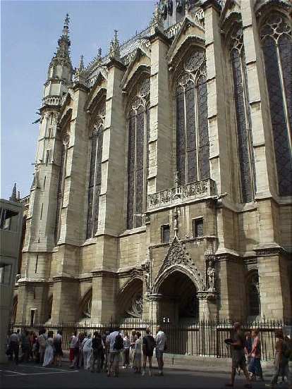 This is the St. Chapelle. Exteriorly, it is not nearly as attractive as the Notre Dame, but I hear the interior is exquisite. The queue (which you can see in the picture) dissuaded me from going in, though. (17 Aug 2003) This is the St. Chapelle. Exteriorly, it is not nearly as attractive as the Notre Dame, but I hear the interior is exquisite. The queue (which you can see in the picture) dissuaded me from going in, though.