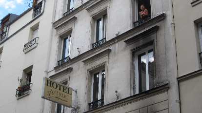 Katia in the window of Hotel Astruc, our home base in Paris. (08 Aug 2013)