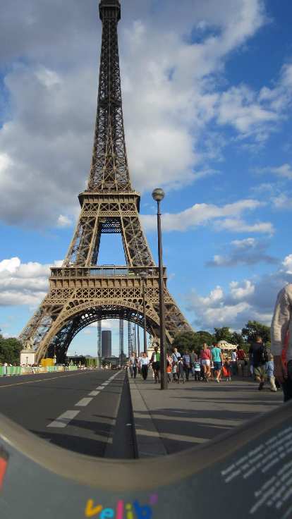 Riding under the Eiffel Tower on a Velib' bicycle.