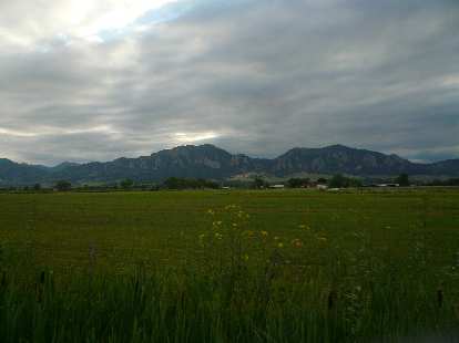 [Mile 182, 6:48 p.m.] The Flatirons west of Boulder were now in sight as we approached Louisville.