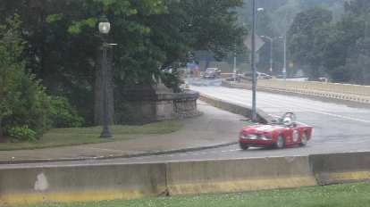 The Triumph TR250 doing a qualification lap outside of Kristina and Juergen's wedding at the Phipps Conservatory, in the rain!