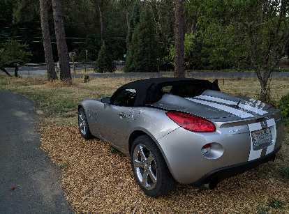 Popping the trunk of a Pontiac Solstice will release the buttresses of the convertible top.
