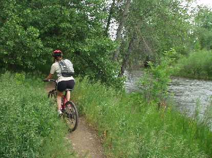 Following Kimi along some single track between the Poudre River and the Poudre (Recreation) Trail. Following Kimi along some single track between the Poudre River and the Poudre (Recreation) Trail.
