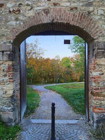 Fall colors beyond a gateway in Prague. Fall colors beyond a gateway in Prague.