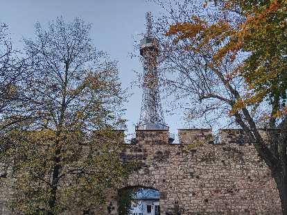 Petrinska rozhledna (lookout tower) beyond a castle wall in Prague.