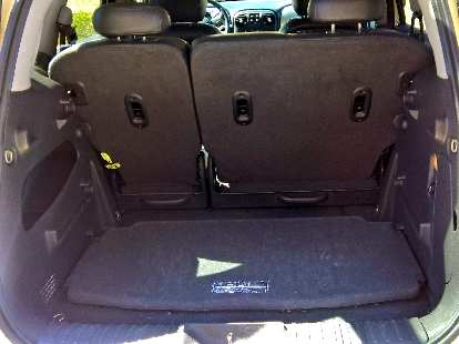 The PT Cruiser's parcel shelf stowed away on the floor of the cargo area.