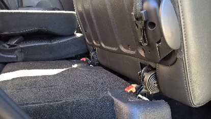 Detail of the latches holding the removable rear seats down to the floor. Detail of the latches holding the removable rear seats down to the floor.
