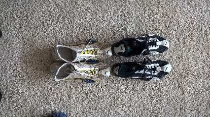 Overhead view of white, yellow and blue 2008 Puma H-Street shoes after 1174 miles.