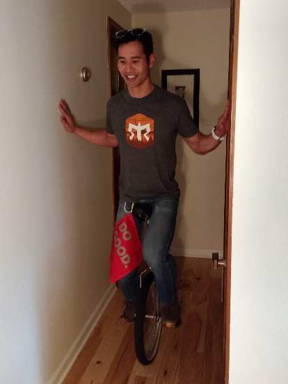 Felix Wong riding a unicycle... sort of.