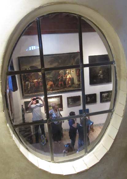 View of the living room through an oval window. View of the living room through an oval window.