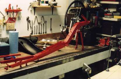 The frame of the Reynolds Wishbone recumbent was painted Porsche Guards Red by a local auto body shop. red frame, Reynolds Wishbone recumbent