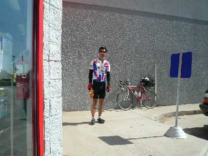 [Mile 308, 9:37 a.m.] Felix Wong with a bag of Doritos in Kersey.  By this time it was getting pretty hot (high 80s).