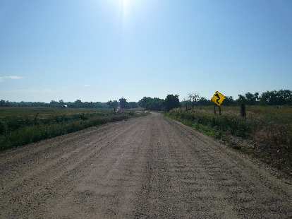 [Mile 294, 8:13 a.m.] Washboard dirt road: turns out this was NOT on route!  Too bad I rode over it for about a mile!