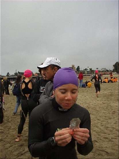 Sharon and her Gu, getting ready for the 1-mile swim in the Pacific Ocean.