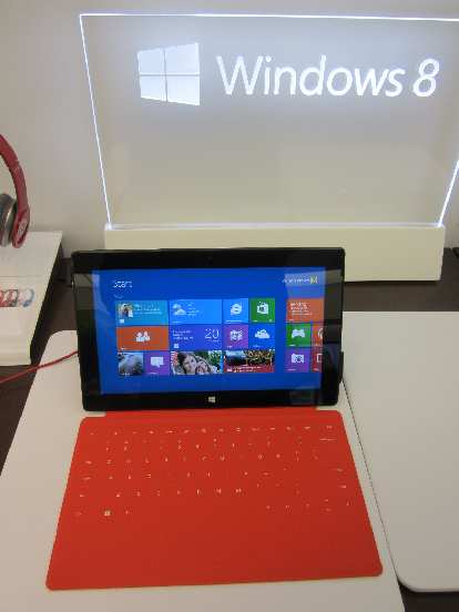 The Microsoft Surface with a red touch cover.