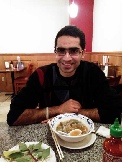 Mehdi having some pho for the first time at New Saigon Restaurant in downtown Seattle.