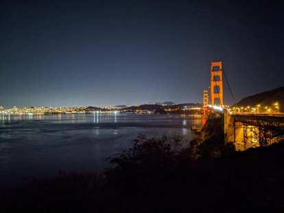 The Golden Gate Bridge at night as seen from the Sausalito side.