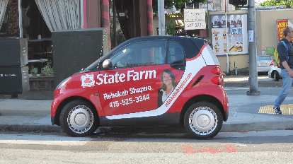 A red Smart car providing good advertising.