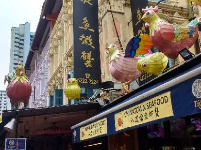 Rooster decorations on the roof of Chinatown Seafood in Singapore. Rooster decorations on the roof of Chinatown Seafood in Singapore.