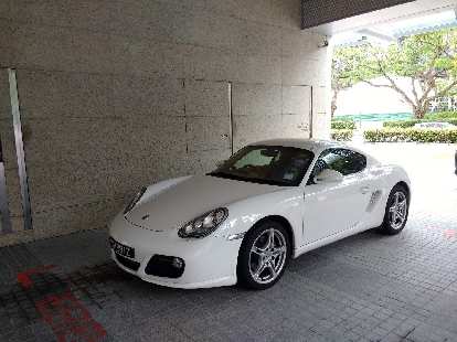 A white first-generation Porsche Cayman in Singapore.