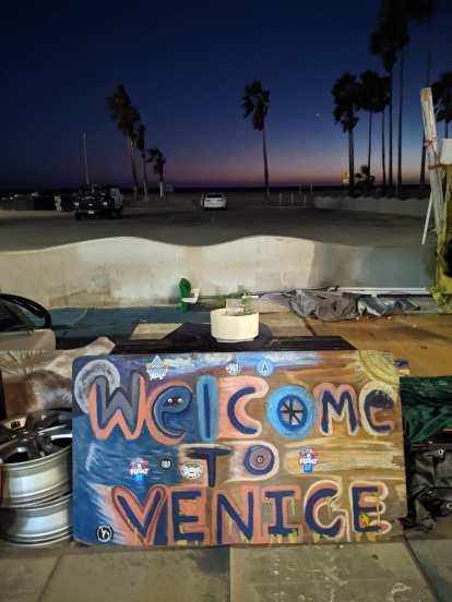 A Welcome to Venice sign at Venice Beach in southern California.