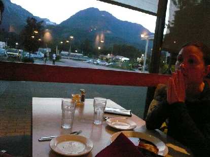 Having dinner at Giuseppe Restaurant with a view of some mountains out the window.
