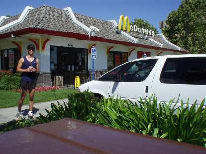 [Mile 23.3, 10:40 a.m.] Now in "troubled" territory.  However, whether it be East Palo Alto (as here) or France, McD's has been there in my time of need.  Here I am with a vanilla milkshake that really energized me for