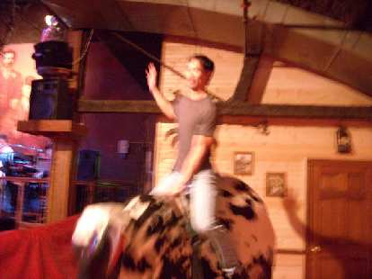 Felix Wong riding the bull. Felix Wong riding the bull.