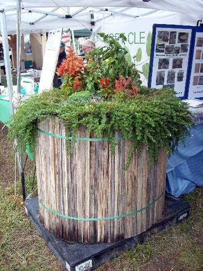 A portable planter made from tractor tires hidden within.