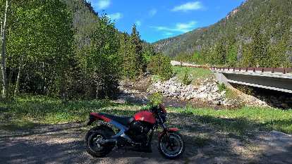 Felix Wong's red 2003 Buell Blast in the Poudre Canyon.