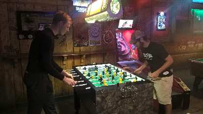 Michael Wacker and Adam Kazilsky---two veterans of the Trans Am Bike Race---playing foosball at the Trail Head in Fort Collins, Colorado.