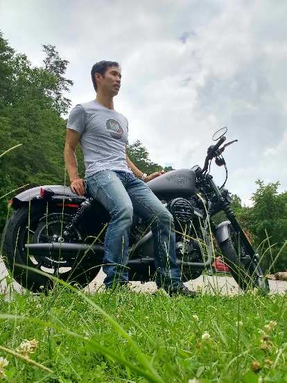 Felix Wong with a Charcoal Denim Harley-Davidson Sportster Iron 883 off Rt. 129 near Chilhowee, Tennessee.