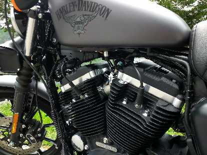 The V-twin engine of a Charcoal Denim Harley-Davidson Sportster Iron 883. The V-twin engine of a Charcoal Denim Harley-Davidson Sportster Iron 883.