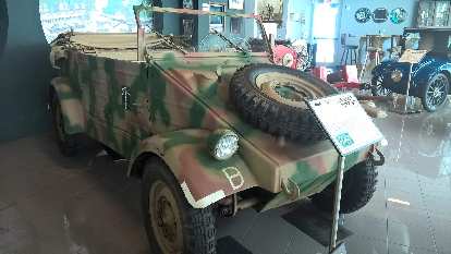 The Kuzelwagen Type 82 was designed by Dr. Ferdinand Porsche and was originally a dune buggy. During World War II it was turned into a "German Jeep" for military duty. camouflaged Kuzelwagen Type 82