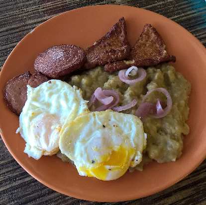 "Tres golpes" ("three hits") at the Mangú Latin Restaurant in Brandon, Florida included eggs, sausage, fried cheese and mashed plantains.