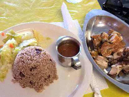 Cabbage, brown rice, and jerk chicken at the Jerk Center in Palm Harbor, Florida.