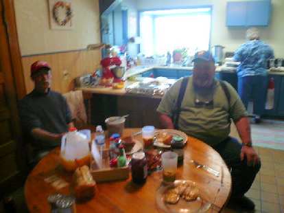 Day 9: In Grant, MT, I stopped by a restaurant that was permanently closed. Thankfully, the residents nearby -- including Mike (center) and his wife Barbara (right) -- inivited me inside their home for a toast, bacon and egg breakfast. I also bought some food and water from them. Day 9: In Grant, MT, I stopped by a restaurant that was permanently closed. Thankfully, the residents nearby -- including Mike (center) and his wife Barbara (right) -- inivited me inside their home for a toast, bacon and egg breakfast. I also bought some food and water from them.