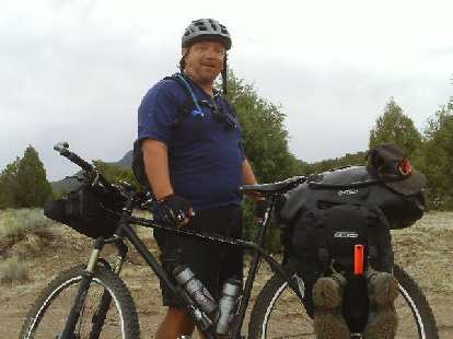 Day 25: Shortly after Pie Town, NM (where there was no pie or food otherwise), I encountered northbound cycle-tourist Tim Saelens. I was bonking badly and he very generously gave me some pasta, oatmeal, and Heed powder. Day 25: Shortly after Pie Town, NM (where there was no pie or food otherwise), I encountered northbound cycle-tourist Tim Saelens. I was bonking badly and he very generously gave me some pasta, oatmeal, and Heed powder.
