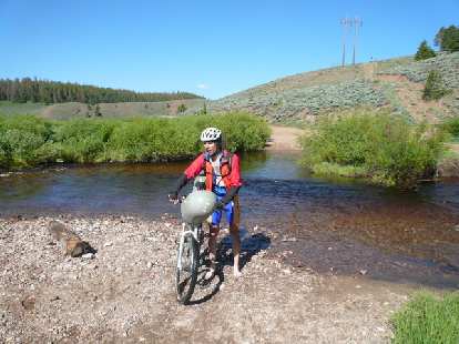 [Day 17] Had to ford a knee-deep river.  This is John Nobile (the ultimate winner of the concurrent Great Divide Race) fording it right after me.
