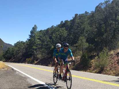 Chris Scott and Dan Berlin cruising on a pine tree-lined road in southern Colorado. (18 Jun 2018) Chris Scott and Dan Berlin cruising on a pine tree-lined road in southern Colorado.