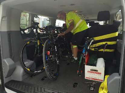 Steve O'Leary (assistant crew chief) securing tandem bicycles inside a van after a bike chain broke on the road. (21 Jun 2018) Steve O'Leary (assistant crew chief) securing tandem bicycles inside a van after a bike chain broke on the road.