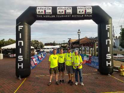 Team Sea to See's RV drivers Nate Faudel, Russ Stevens, Brad Thurman, and Matt Hannifin at the 2018 Race Across America finish line.