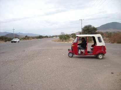 We took a tuk-tuk (three-wheeled taxi) back to the area where we were dropped off the bus earlier in the day. We took a tuk-tuk (three-wheeled taxi) back to the area where we were dropped off the bus earlier in the day.